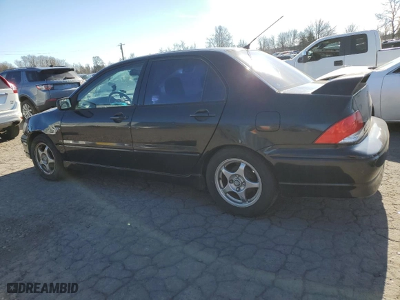 2002 Mitsubishi Lancer OZ-Rally with VIN JA3AJ86E92U027551, listed as a Copart auction lot 45020575 with 214,575 mi miles and Salvage Title. Bid and sale history available at carsss.com. Image 2.
