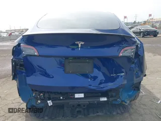 2022 Tesla Model Y Long Range with VIN 7SAYGDEE0NA019067, listed as a IAAI auction lot 41645198 with 49,336 mi miles and . Bid and sale history available at DreamBid. Image 17.