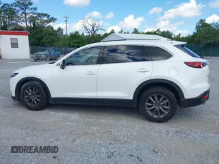 2022 Mazda CX-9 Touring z VIN JM3TCBCY7N0600787, wystawiony jako IAAI lot #42240512 z przebiegiem 27 927 mil mil oraz . Historia ofert i sprzedaży dostępna na DreamBid. Obrazek 14.