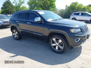 2015 Jeep Grand Cherokee Overland z VIN 1C4RJFCG3FC234673, wystawiony jako IAAI lot #42532428 z przebiegiem 146 366 mil mil oraz . Historia ofert i sprzedaży dostępna na DreamBid. Obrazek 1.