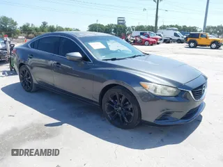 2014 Mazda Mazda6 i Touring with VIN JM1GJ1V69E1146705, listed as a IAAI auction lot 42022033 with 123,239 mi miles. Bid and sale history available at carsss.com. Image 1.