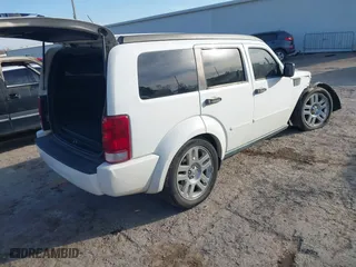 2011 Dodge Nitro Heat with VIN 1D4PT4GK0BW582589, listed as a IAAI auction lot 41015035 with 130,098 mi miles. Bid and sale history available at carsss.com. Image 4.