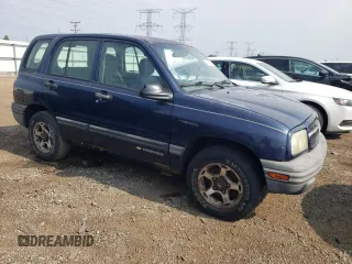 2001 Chevrolet Tracker z VIN 2CNBJ13C616955326, wystawiony jako Copart lot #64105184 z przebiegiem 138 156 mil mil oraz Tytuł czysty. Historia ofert i sprzedaży dostępna na DreamBid. Obrazek 4.