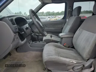 2000 Nissan Frontier XE with VIN 1N6ED27T3YC343320, listed as a Copart auction lot 64883025 with 168,047 mi miles and Clean title. Bid and sale history available at DreamBid. Image 7.
