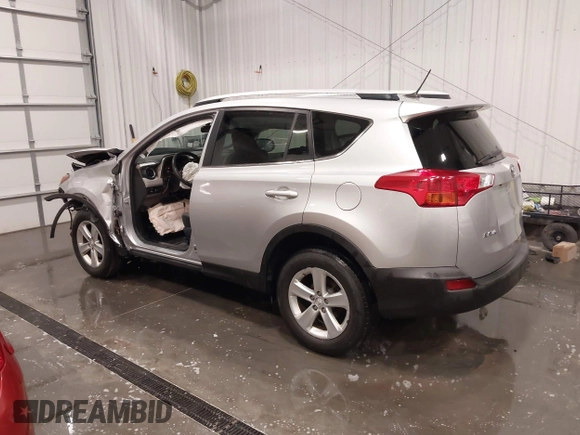 2014 Toyota RAV4 XLE with VIN JTMRFREV5ED052819, listed as a IAAI auction lot 42014672 with 235,481 mi miles and . Bid and sale history available at DreamBid. Image 3.