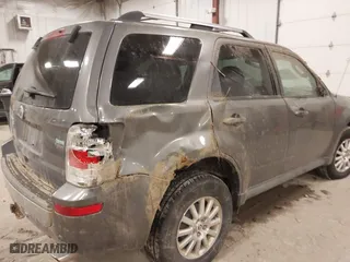 2010 Mercury Mariner Premier with VIN 4M2CN9HGXAKJ11983, listed as a IAAI auction lot 41512060 with 154,971 mi miles. Bid and sale history available at carsss.com. Image 6.