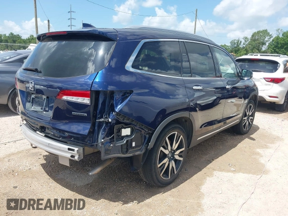 2022 Honda Pilot Touring 7-Passenger with VIN 5FNYF5H61NB019768, listed as a IAAI auction lot 42438780 with Not provided miles and . Bid and sale history available at DreamBid. Image 4.