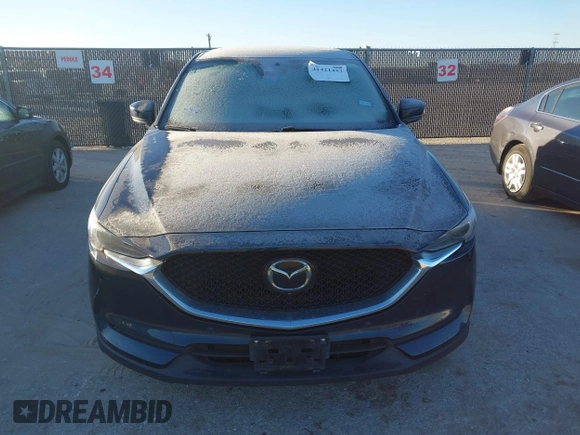 2019 Mazda CX-5 Signature with VIN JM3KFBEY5K0656965, listed as a IAAI auction lot 41421453 with 99,073 mi miles. Bid and sale history available at carsss.com. Image 12.