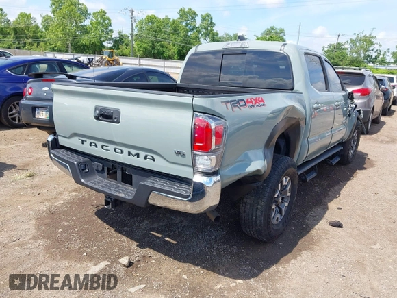 2023 Toyota Tacoma SR with VIN 3TMCZ5AN1PM581266, listed as a IAAI auction lot 42371395 with 32,582 mi miles and . Bid and sale history available at DreamBid. Image 4.