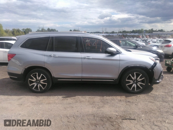 2022 Honda Pilot Touring 7-Passenger with VIN 5FNYF6H60NB013465, listed as a IAAI auction lot 40139627 with 78,161 mi miles. Bid and sale history available at carsss.com. Image 13.