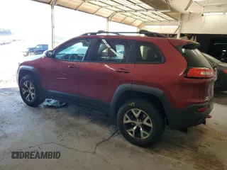 2015 Jeep Cherokee Trailhawk with VIN 1C4PJMBS1FW745928, listed as a Copart auction lot 62032585 with 132,559 mi miles and Salvage title. Bid and sale history available at DreamBid. Image 2.
