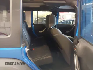 2015 Jeep Wrangler Unlimited Rubicon with VIN 1C4BJWFG7FL661643, listed as a IAAI auction lot 41291385 with 112,785 mi miles. Bid and sale history available at carsss.com. Image 8.