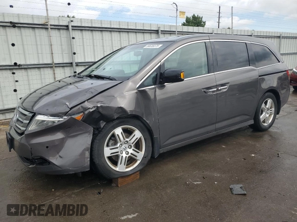 2012 Honda Odyssey Touring with VIN 5FNRL5H94CB109257, listed as a Copart auction lot 59636075 with 107,543 mi miles and Salvage title. Bid and sale history available at DreamBid. Image 1.