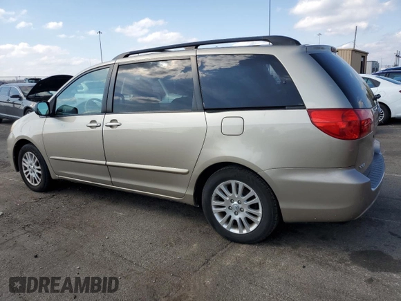 2010 Toyota Sienna XLE with VIN 5TDYK4CCXAS330463, listed as a Copart auction lot 52581315 with 226,668 mi miles and Salvage Title. Bid and sale history available at carsss.com. Image 2.