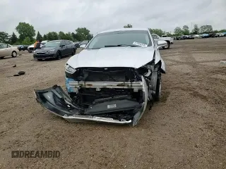 2013 Ford Fusion SE Hybrid с VIN 3FA6P0LU9DR233472, выставлен на аукционе Copart как лот 57994345 с пробегом 194 862 миль миль и Списание • Salvage title. История ставок и продаж доступна на DreamBid. Изображение 14.