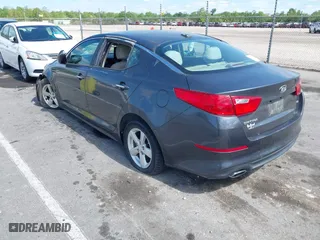 2015 Kia Optima LX with VIN KNAGM4A71F5634755, listed as a IAAI auction lot 42019729 with 101,064 mi miles. Bid and sale history available at carsss.com. Image 3.