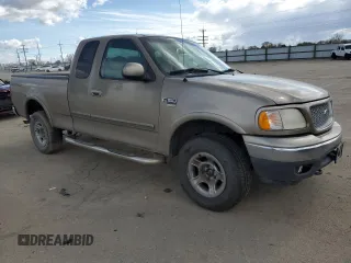 2001 Ford F-150 XL with VIN 1FTRX18L01KE64063, listed as a Copart auction lot 51500775 with 326,070 mi miles and Salvage title. Bid and sale history available at DreamBid. Image 4.