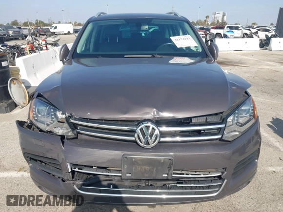 2011 Volkswagen Touareg Sport with VIN WVGFF9BP3BD002517, listed as a IAAI auction lot 42174143 with 156,337 mi miles and . Bid and sale history available at DreamBid. Image 6.