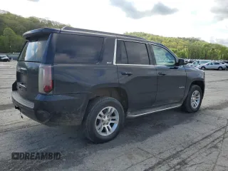 2015 GMC Yukon SLT with VIN 1GKS2BKC6FR145140, listed as a Copart auction lot 55451365 with 216,522 mi miles and Salvage Title. Bid and sale history available at DreamBid. Image 3.