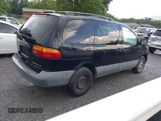 1998 Toyota Sienna LE with VIN 4T3ZF13C6WU016001, listed as a IAAI auction lot 42604162 with 214,491 mi miles and . Bid and sale history available at DreamBid. Image 4.