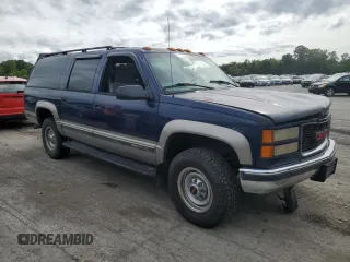 1999 GMC Suburban z VIN 1GKGK26J6XJ771768, wystawiony jako Copart lot #66300974 z przebiegiem 181 048 mil mil oraz Szkody całkowita. Historia ofert i sprzedaży dostępna na DreamBid. Obrazek 4.