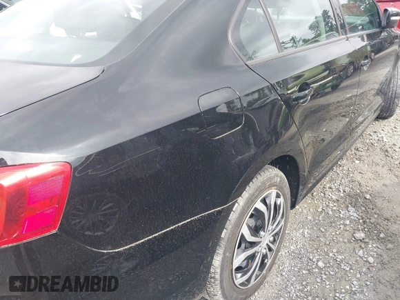 2014 Volkswagen Jetta SE z VIN 3VWD07AJ6EM294202, wystawiony jako IAAI lot #42364119 z przebiegiem 77 393 mil mil oraz . Historia ofert i sprzedaży dostępna na DreamBid. Obrazek 6.