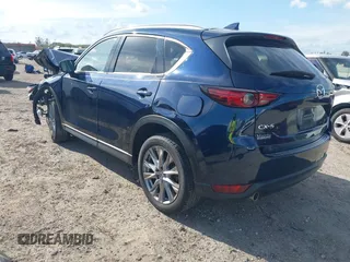 2021 Mazda CX-5 Grand Touring with VIN JM3KFADM0M0469886, listed as a IAAI auction lot 41617270 with 33,571 mi miles. Bid and sale history available at carsss.com. Image 3.