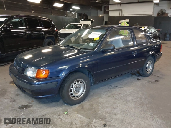1996 Toyota Tercel DX z VIN JT2AC52L9T0139217, wystawiony jako IAAI lot #41898808 z przebiegiem 86 500 mil mil oraz . Historia ofert i sprzedaży dostępna na DreamBid. Obrazek 2.