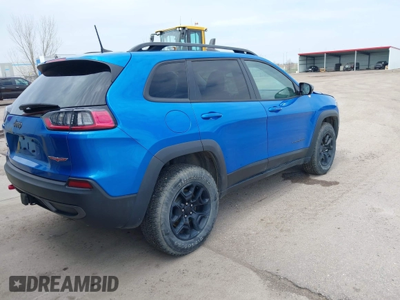 2022 Jeep Cherokee Trailhawk z VIN 1C4PJMBX4ND513488, wystawiony jako IAAI lot #42137114 z przebiegiem 12 306 mil mil oraz . Historia ofert i sprzedaży dostępna na DreamBid. Obrazek 4.