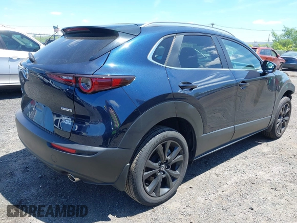 2024 Mazda CX-30 S Select Sport with VIN 3MVDMBBM2RM657781, listed as a IAAI auction lot 42297311 with 13,677 mi miles and . Bid and sale history available at DreamBid. Image 4.