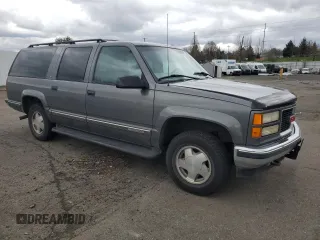 1999 GMC Suburban with VIN 1GKFK16R0XJ772880, listed as a Copart auction lot 46986325 with 237,921 mi miles and Clean Title. Bid and sale history available at carsss.com. Image 4.