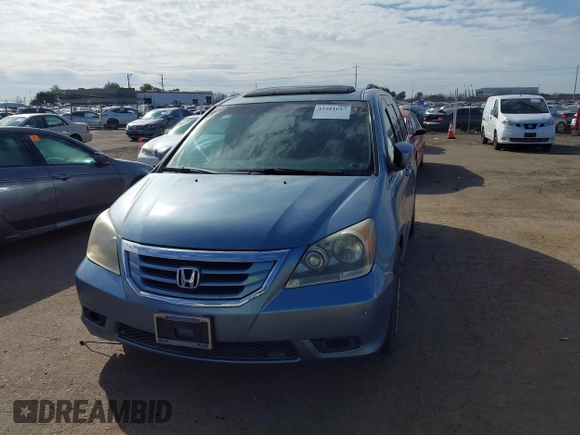 2008 Honda Odyssey Touring with VIN 5FNRL38868B047556, listed as a IAAI auction lot 41581617 with 220,436 mi miles. Bid and sale history available at carsss.com. Image 6.