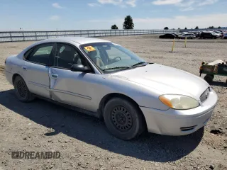 2005 Ford Taurus SE with VIN 1FAFP53U25A303516, listed as a Copart auction lot 63250505 with 203,463 mi miles and Salvage title. Bid and sale history available at DreamBid. Image 4.