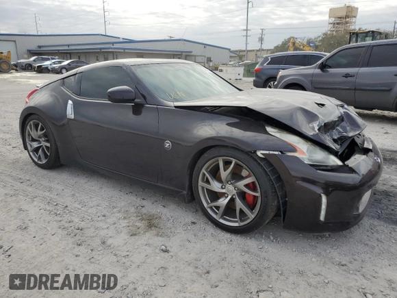 2014 Nissan 370Z Nismo with VIN JN1AZ4EH3EM633305, listed as a Copart auction lot 42846795 with 45,430 mi miles and Salvage Title. Bid and sale history available at DreamBid. Image 4.