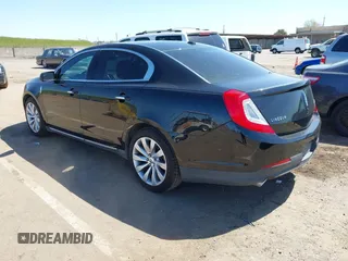 2014 Lincoln MKS with VIN 1LNHL9DK0EG600330, listed as a IAAI auction lot 41953968 with 228,668 mi miles. Bid and sale history available at carsss.com. Image 3.