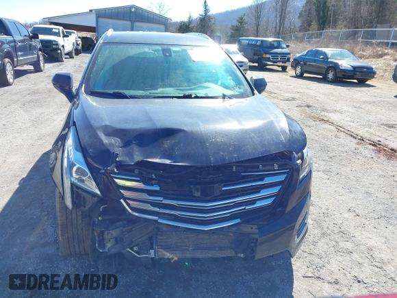 2018 Cadillac XT5 FWD with VIN 1GYKNARS5JZ235585, listed as a IAAI auction lot 41607440 with 77,220 mi miles and . Bid and sale history available at DreamBid. Image 12.