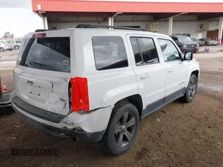 2014 Jeep Patriot High Altitude with VIN 1C4NJPFA0ED667162, listed as a IAAI auction lot 41752271 with 131,038 mi miles and . Bid and sale history available at carsss.com. Image 4.