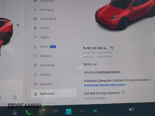 2021 Tesla Model Y Long Range with VIN 5YJYGDEE0MF209191, listed as a IAAI auction lot 41937507 with 56,131 mi miles. Bid and sale history available at carsss.com. Image 7.
