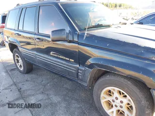 1998 Jeep Grand Cherokee Limited with VIN 1J4GX78Y8WC110325, listed as a IAAI auction lot 41357373 with 165,106 mi miles. Bid and sale history available at carsss.com. Image 6.