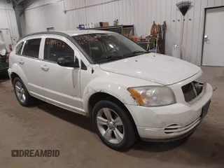 2010 Dodge Caliber SXT with VIN 1B3CB4HA3AD590654, listed as a IAAI auction lot 41814572 with 203,422 mi miles and . Bid and sale history available at DreamBid. Image 1.