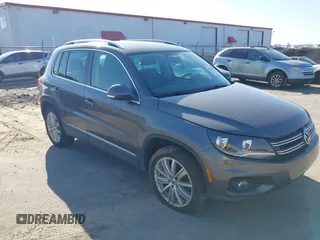 2012 Volkswagen Tiguan SE with VIN WVGAV7AX5CW000275, listed as a IAAI auction lot 41789246 with 123,618 mi miles and . Bid and sale history available at DreamBid. Image 1.