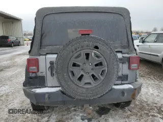 2015 Jeep Wrangler Unlimited Willys Wheeler with VIN 1C4BJWDG9FL516493, listed as a Copart auction lot 45098345 with 152,009 mi miles and Salvage Title. Bid and sale history available at DreamBid. Image 6.