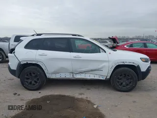 2019 Jeep Cherokee Trailhawk with VIN 1C4PJMBN6KD124023, listed as a IAAI auction lot 41432217 with 76,934 mi miles and . Bid and sale history available at DreamBid. Image 14.