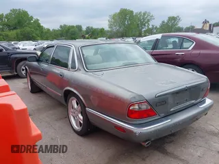 2002 Jaguar XJ with VIN SAJDA12CX2LF49531, listed as a IAAI auction lot 42124743 with 120,486 mi miles. Bid and sale history available at carsss.com. Image 3.