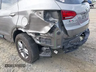 2018 Hyundai Santa Fe 2.4L z VIN 5NMZUDLB4JH073857, wystawiony jako IAAI lot #42200208 z przebiegiem 127 038 mil mil oraz . Historia ofert i sprzedaży dostępna na DreamBid. Obrazek 6.