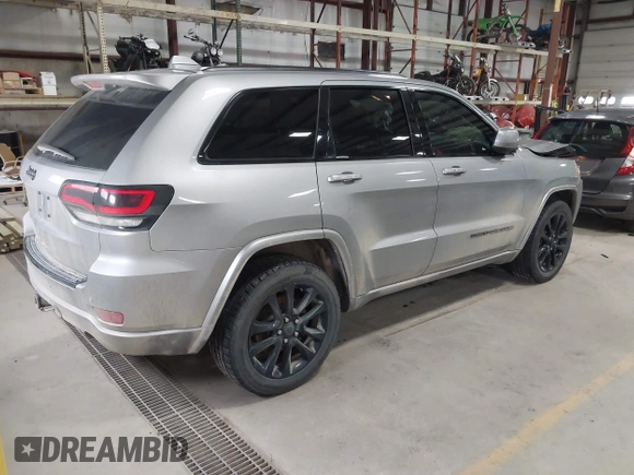 2018 Jeep Grand Cherokee Laredo E with VIN 1C4RJFAG6JC102969, listed as a IAAI auction lot 41963137 with 112,361 mi miles and . Bid and sale history available at DreamBid. Image 4.