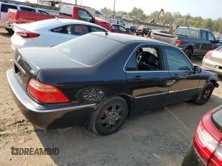 2002 Acura RL with VIN JH4KA96512C013028, listed as a Copart auction lot 71436914 with 142,527 mi miles and Salvage Title. Bid and sale history available at carsss.com. Image 3.