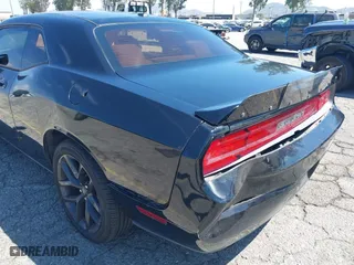 2010 Dodge Challenger SE with VIN 2B3CJ4DV0AH323373, listed as a IAAI auction lot 42081412 with 199,977 mi miles. Bid and sale history available at carsss.com. Image 6.