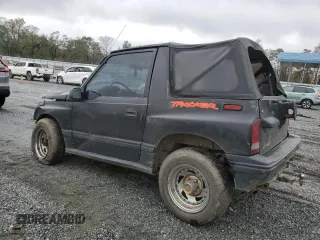 1992 Geo Tracker z VIN 2CNBJ18U8N6938728, wystawiony jako Copart lot #79459914 z przebiegiem 17 751 mil mil oraz Szkody całkowita. Historia ofert i sprzedaży dostępna na DreamBid. Obrazek 2.