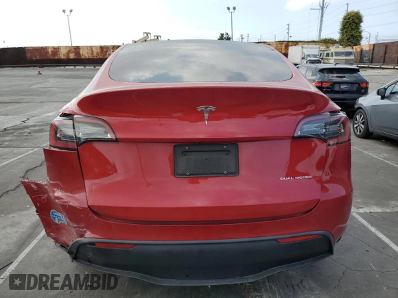 2021 Tesla Model Y Long Range with VIN 5YJYGDEEXMF217816, listed as a Copart auction lot 51008665 with 57,392 mi miles and Salvage Title. Bid and sale history available at DreamBid. Image 6.